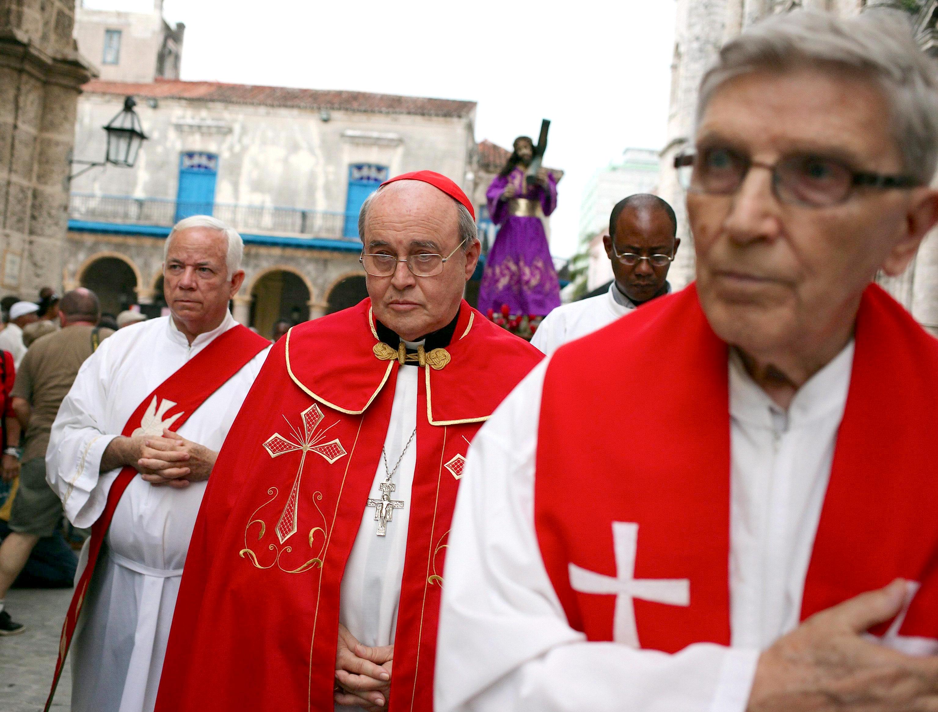 Cuban cardinal Jaime Ortega (C) participates during the procession of the Via Crucis in Havana