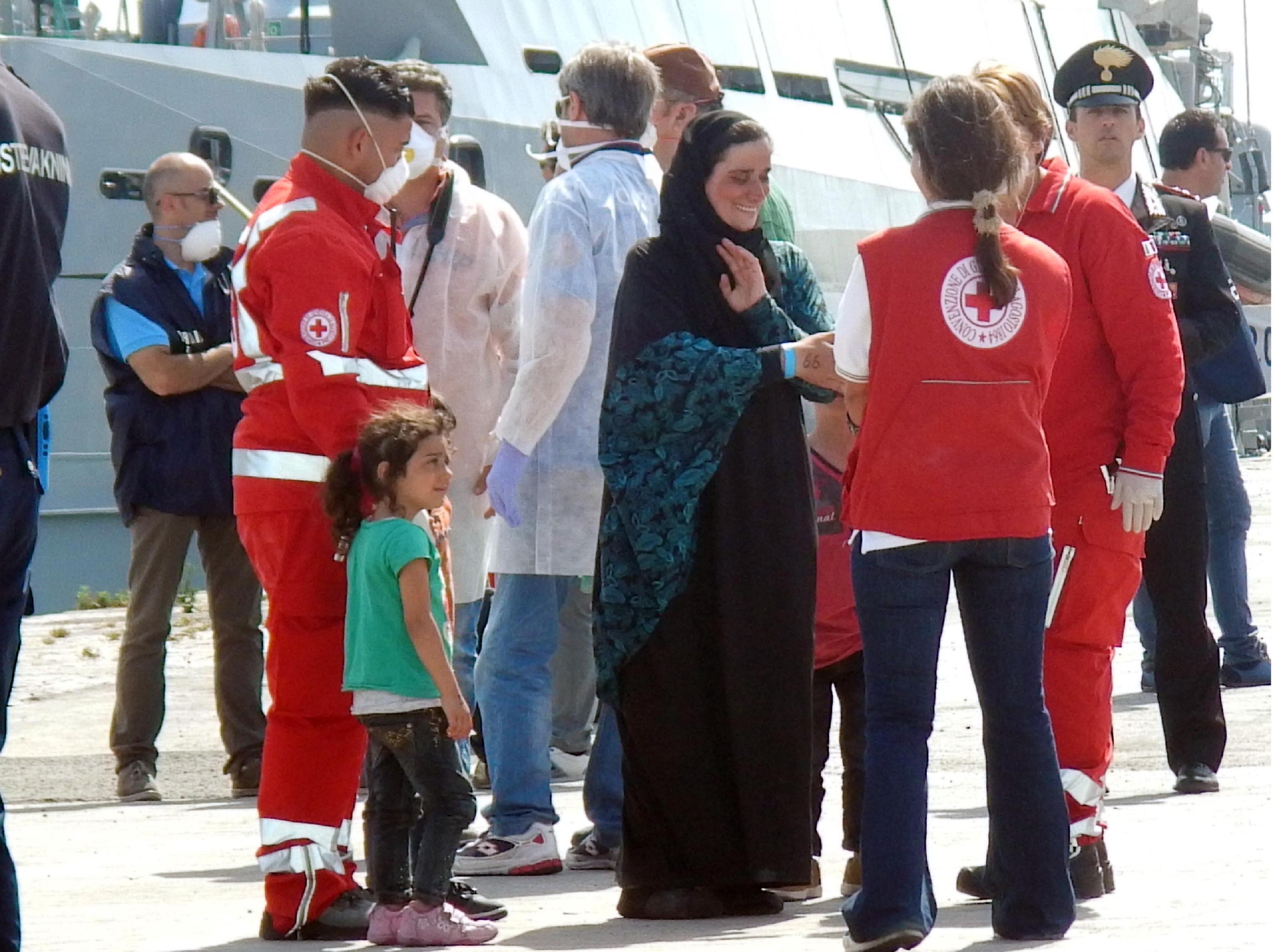 Migrants arrive on Swedish Coast Guard ship KBV 001 Poseidon in Catania