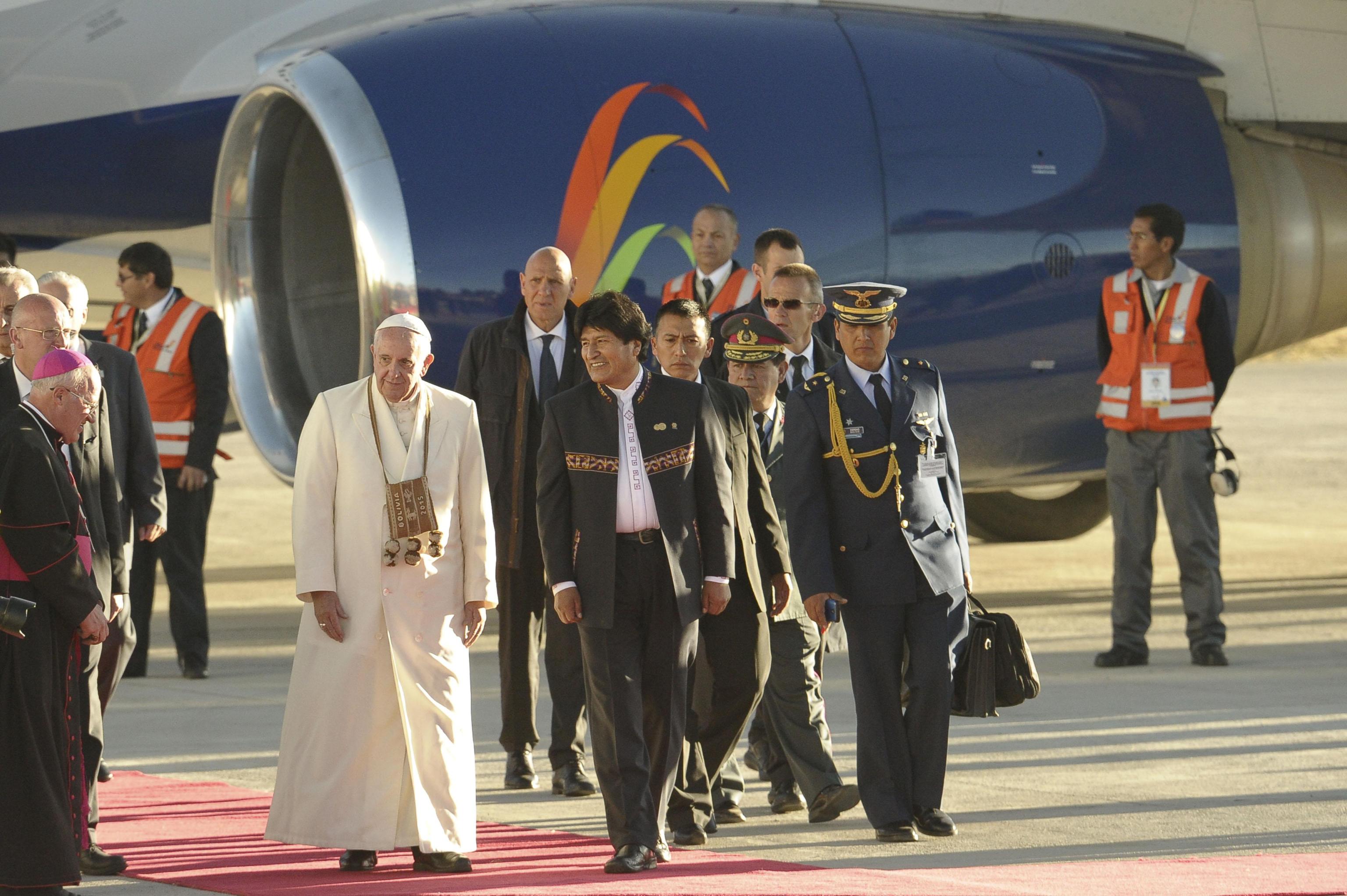 Pope Francis being welcomed by Bolivian President Evo Morales at his arrival at the International Airport of El Alto/La Paz