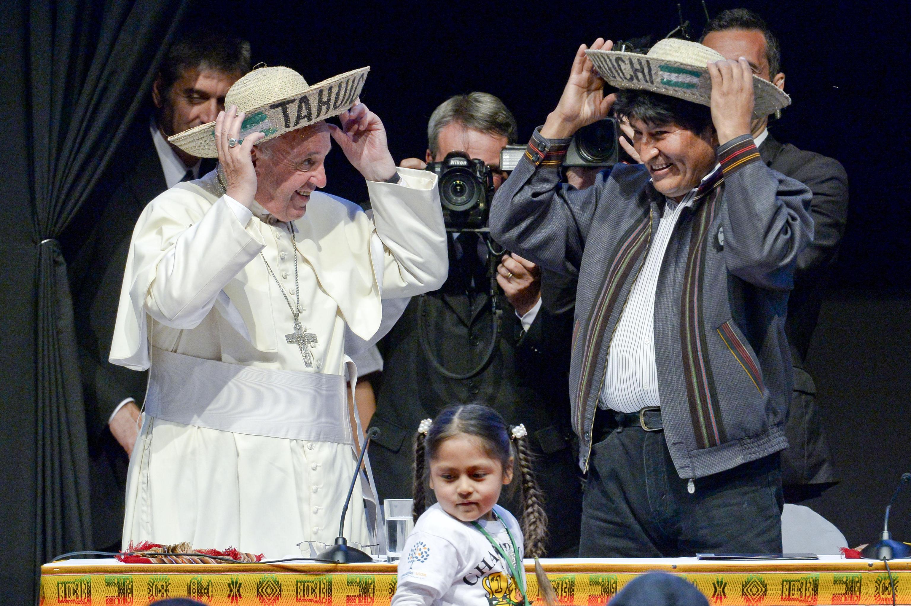 Pope Francis and Bolivian President Evo Morales wearing traditional hats from the region of Santa Cruz