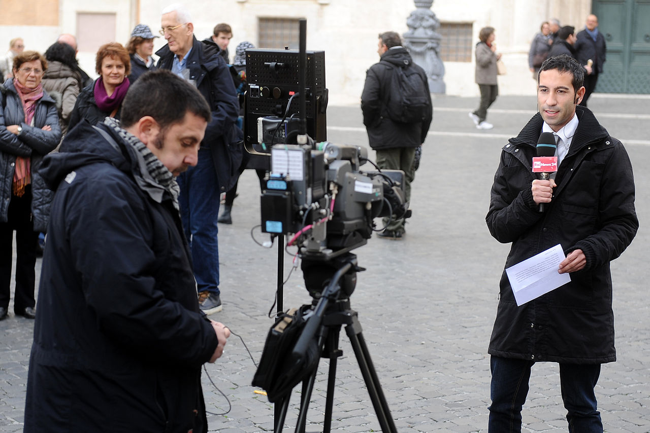 RAI journalist during a direct transmission from Piazza di Montecitorio