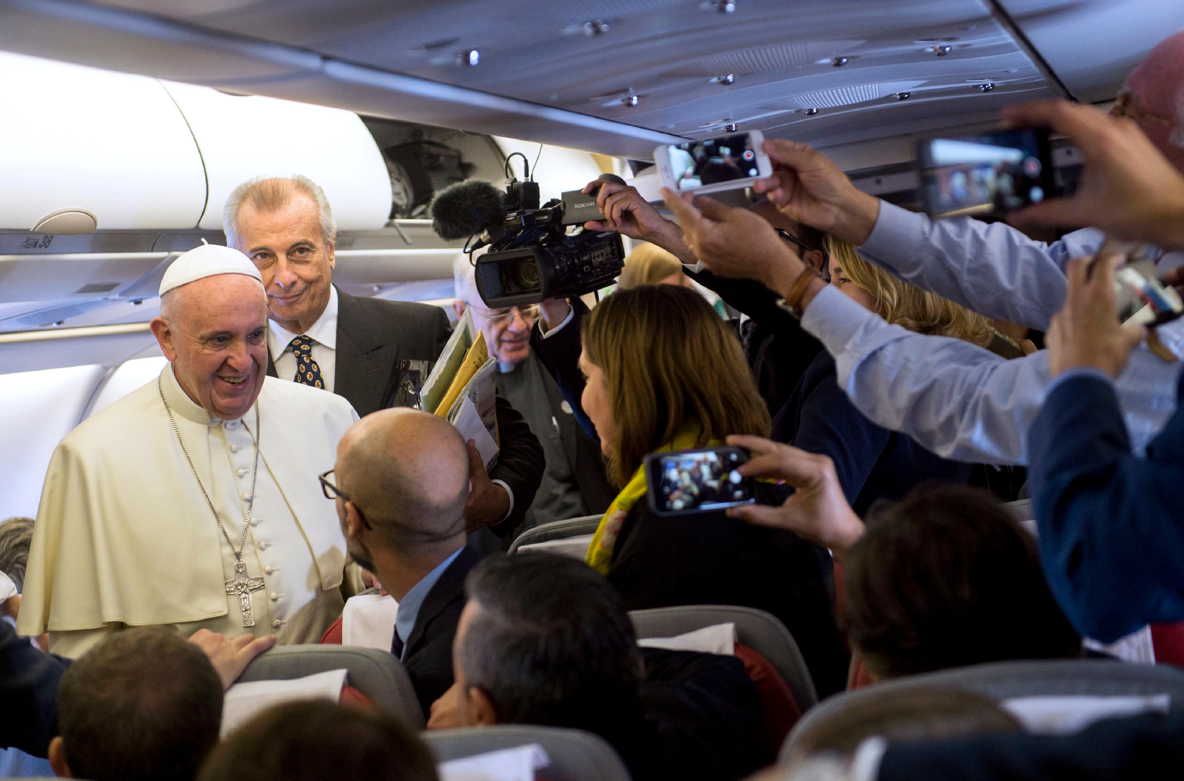 Pope Francis meets with journalists on the papal plane during his flight to Cuba