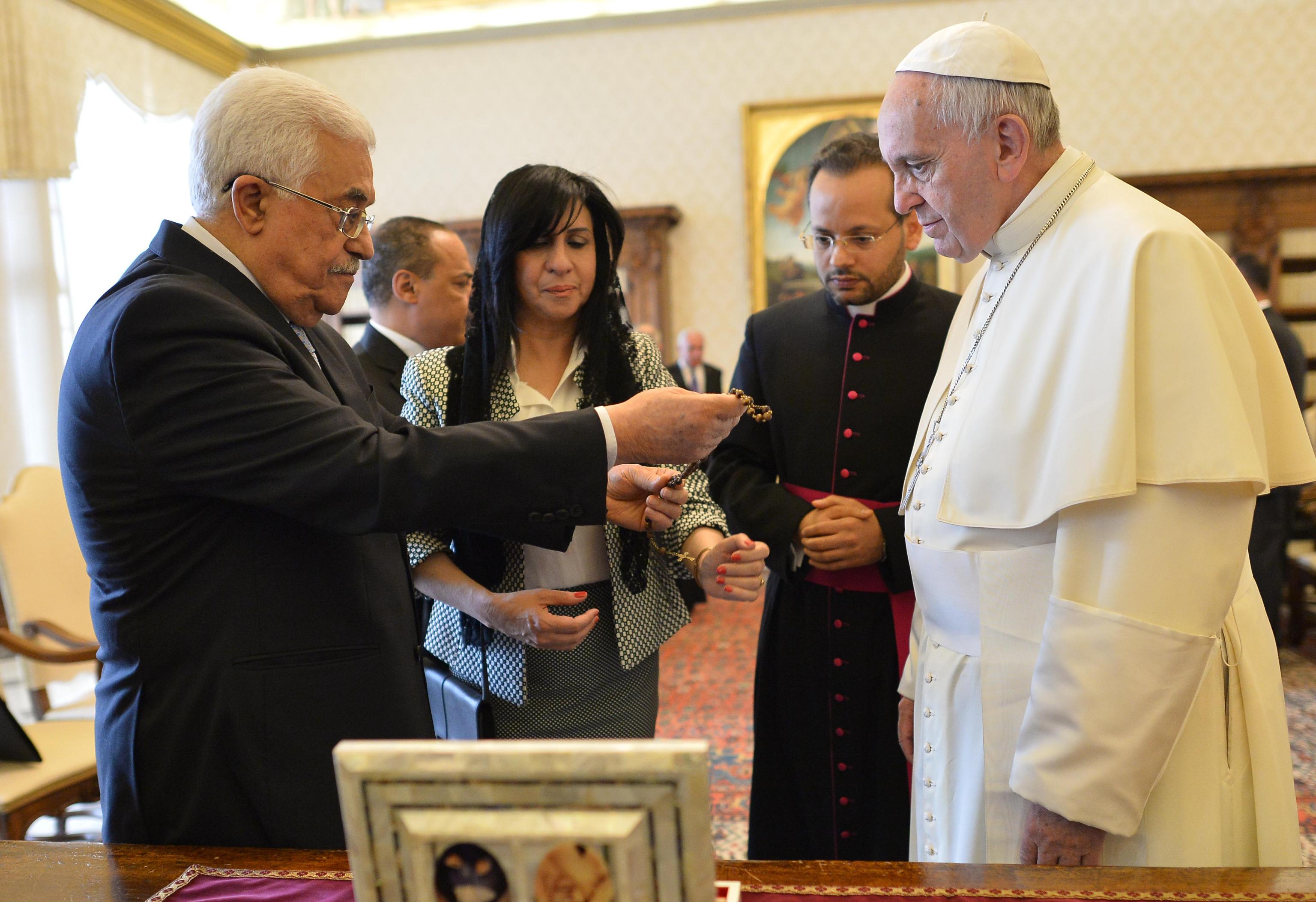 Pope Francis exchanges gifts with Palestinian authority President Mahmoud Abbas during a private audience on May 16
