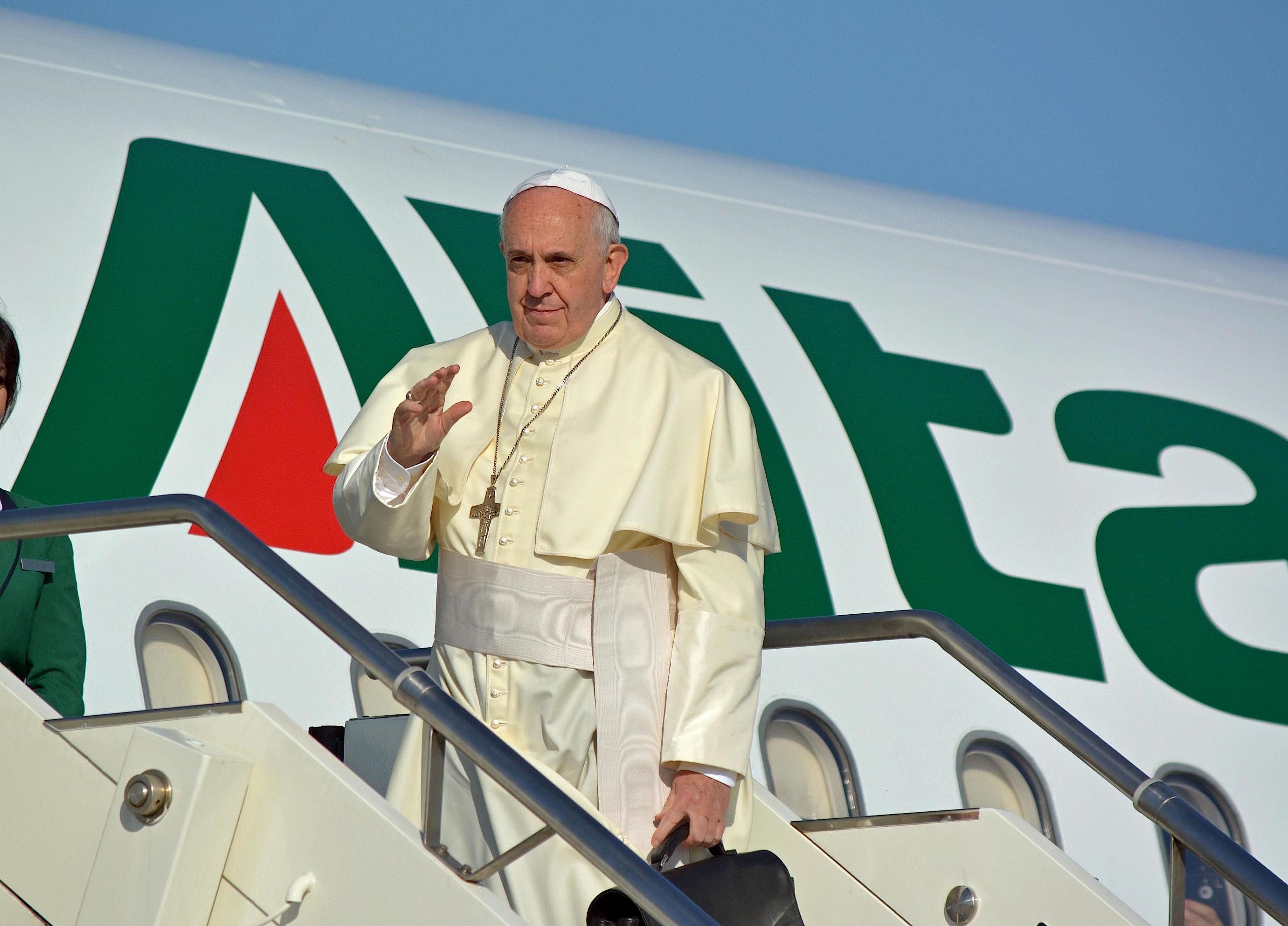 Pope Francesco greets before boarding Alitalia Airbus A321 for Amman at 'Leonardo da Vinci' international airport in Fiumicino