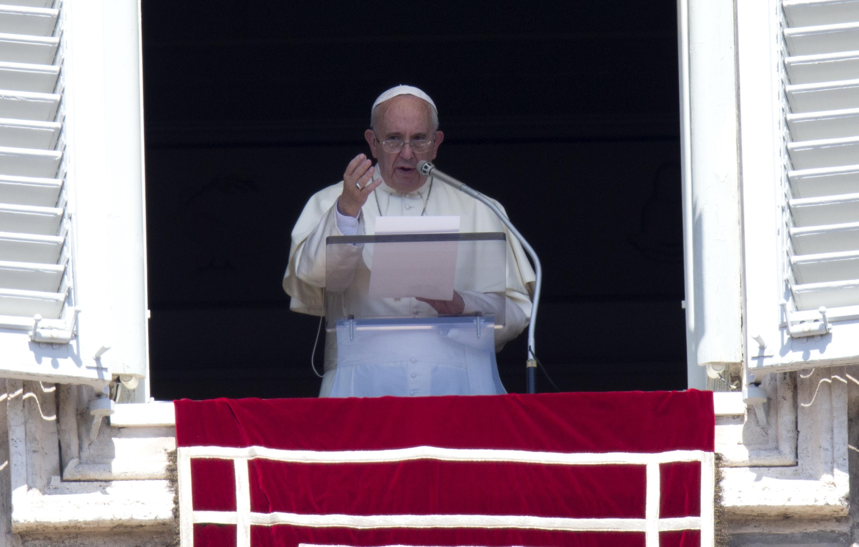 Pope Francis delivers his Sunday Angelus prayer from the window of the Apostolic palace