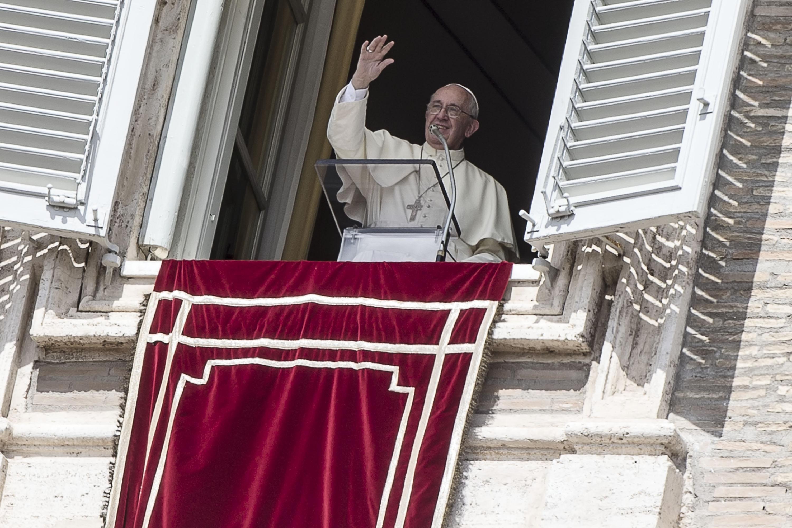 Pope Francis greets faithful during the Angelus prayer in St. Peter's Square