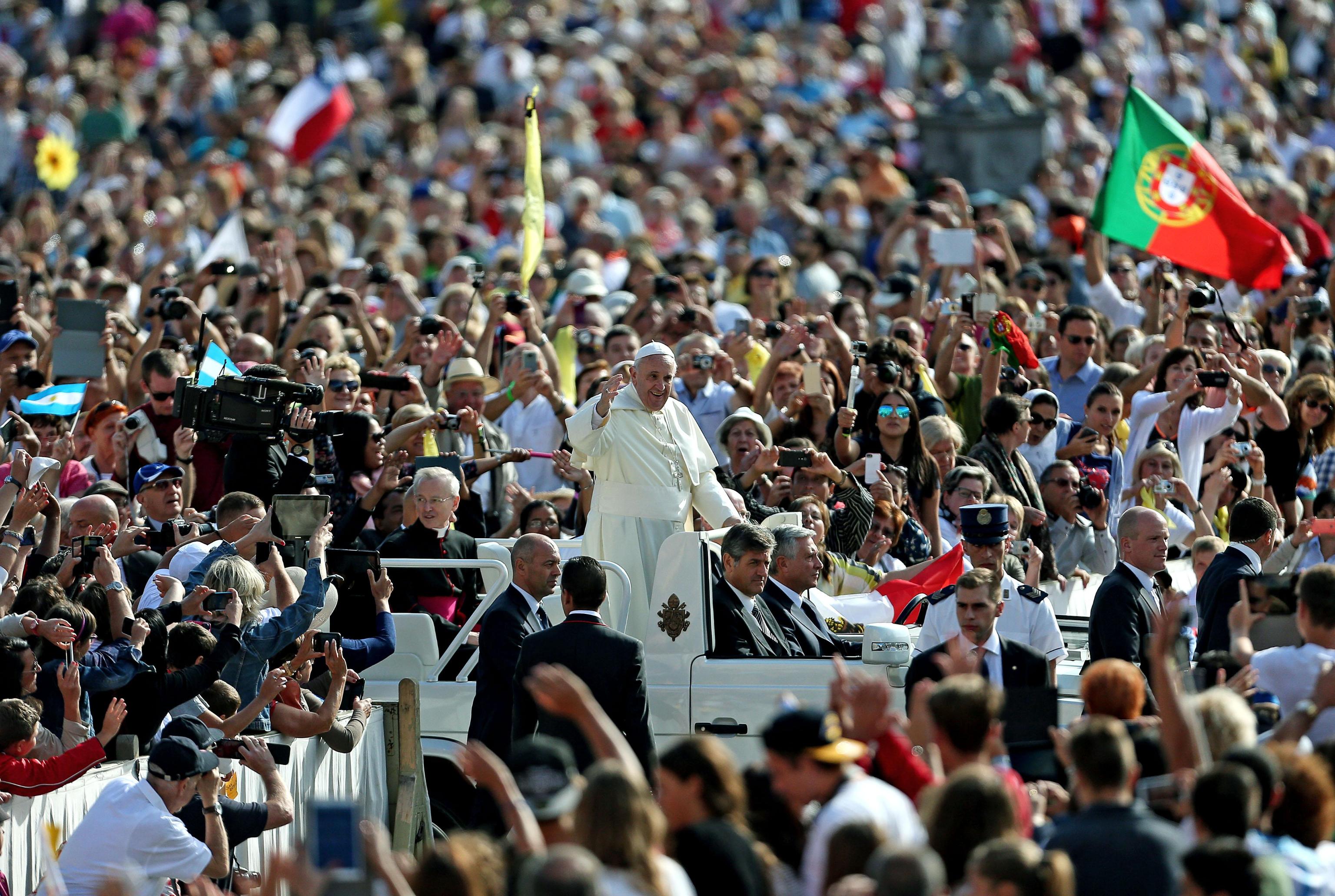 Pope Francis arrives to lead the weekly general audience in Saint Peters Square