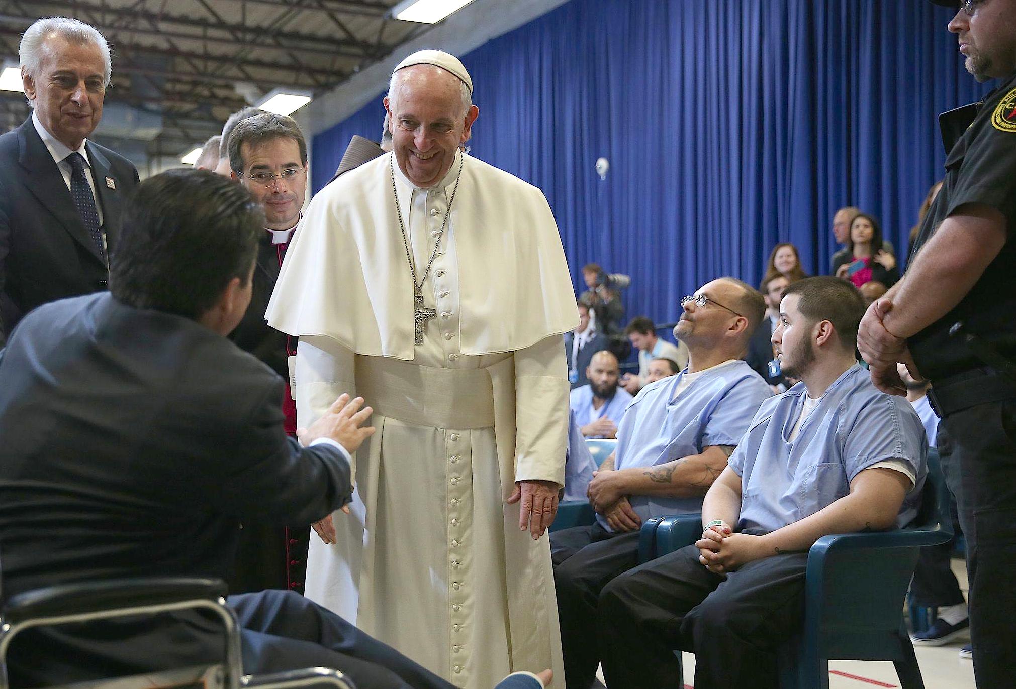 Philadelphia Congressman Brendan Boyle (L) is greeted by Pope Francis (C) as he visits the Curran Fromhold Correctional Facility in Philadelphia