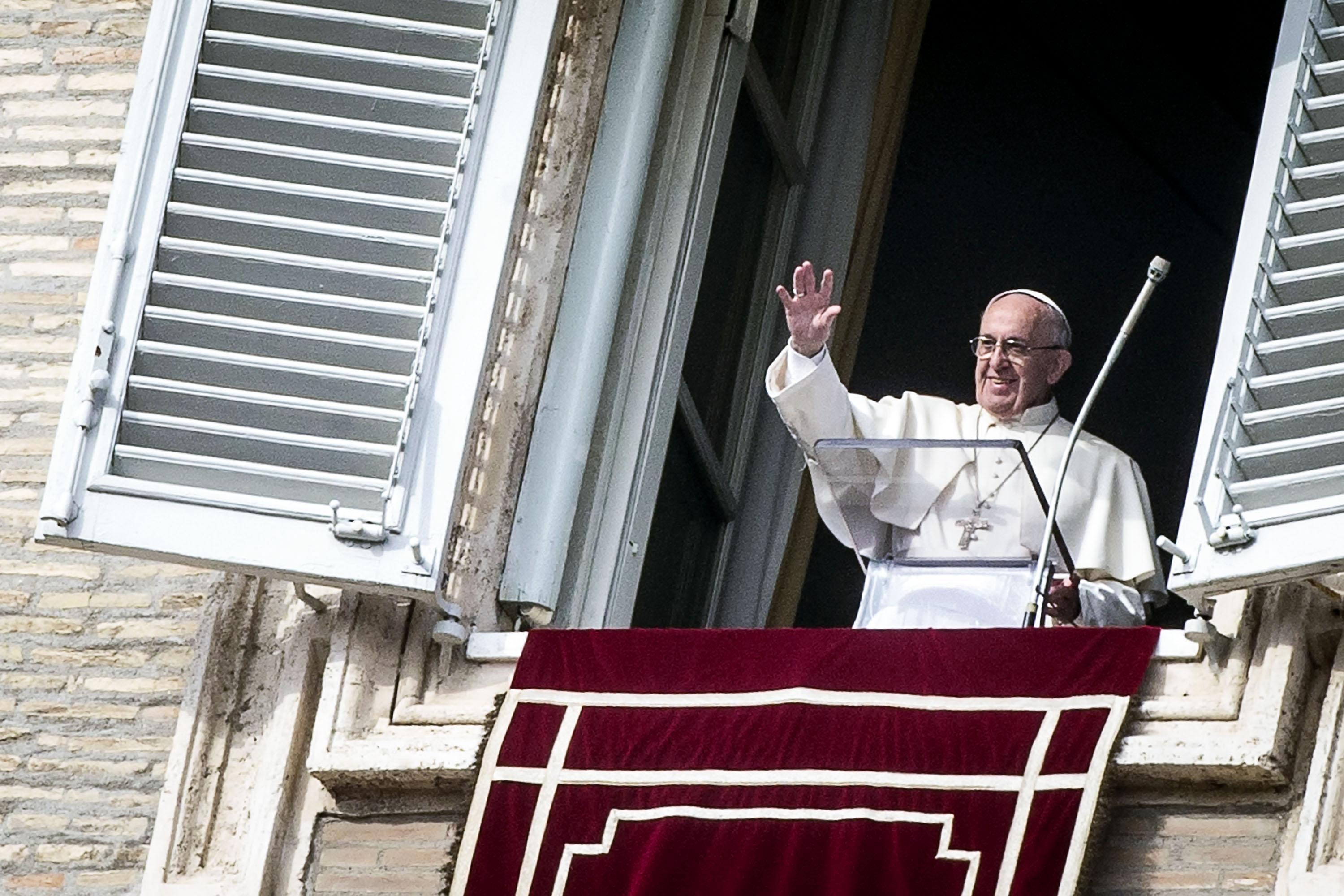 Pope Francis greets the faithful at the Angelus of Tuesday
