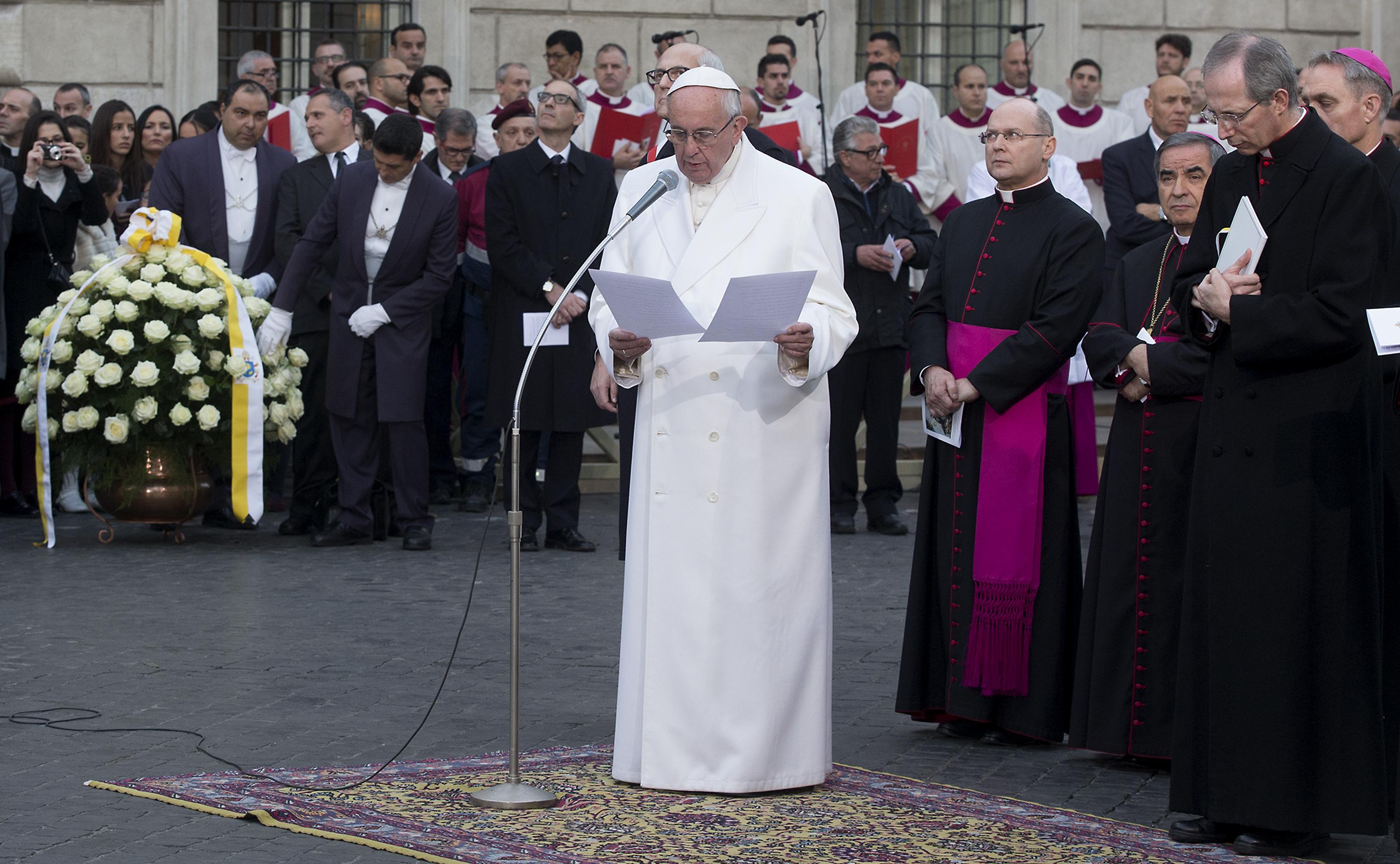 Pope Francis as he leads a prayer at the statue of Virgin Mary during the annual feast of the Immaculate Conception at Piazza Mignanelli in Rome